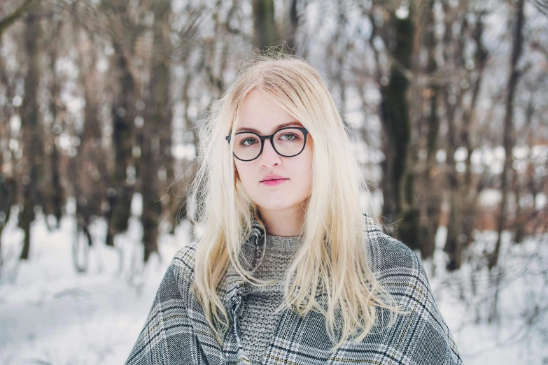 a woman wearing glasses standing in the snow, inspired by Louisa Matthíasdóttir, pexels contest winner, aestheticism, pale hair, square glasses, gif, high-quality 4k portrait