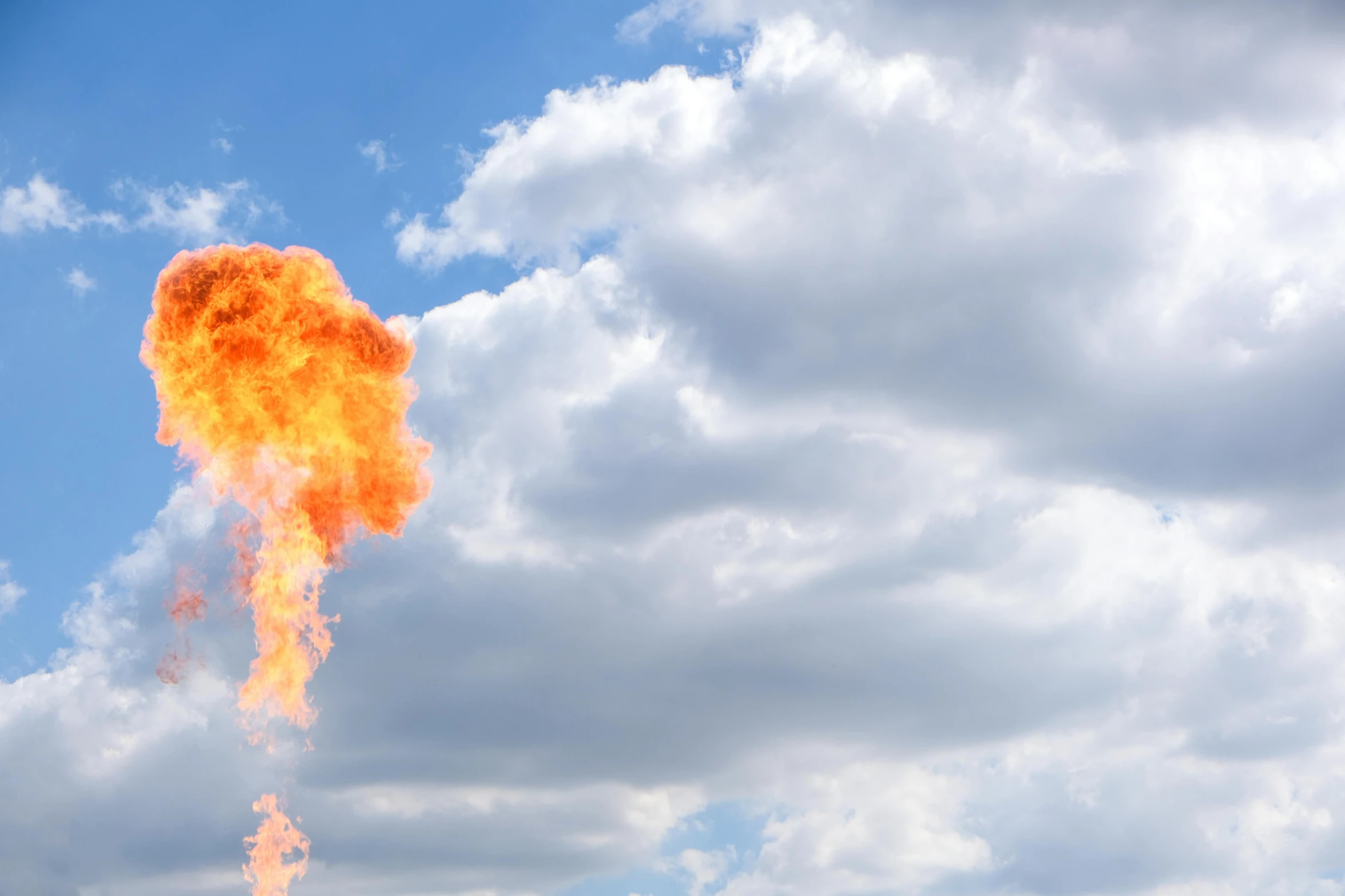 a fire hydrant in the middle of a field, an album cover, unsplash, surrealism, as an air balloon, fireball, big sky, flamethrower