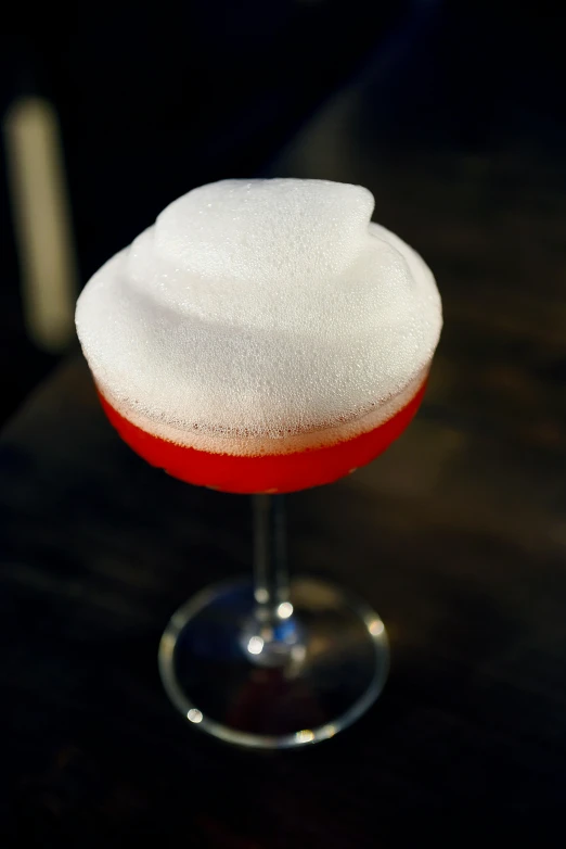 a red and white drink sitting on top of a table, inspired by François Bocion, made of cotton candy, flying saucer, finely textured, profile