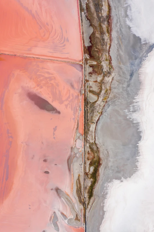 an orange umbrella sitting on top of a sandy beach, an ultrafine detailed painting, inspired by Julian Schnabel, trending on unsplash, conceptual art, satellite view, pink and grey muted colors, geological strata, detail face