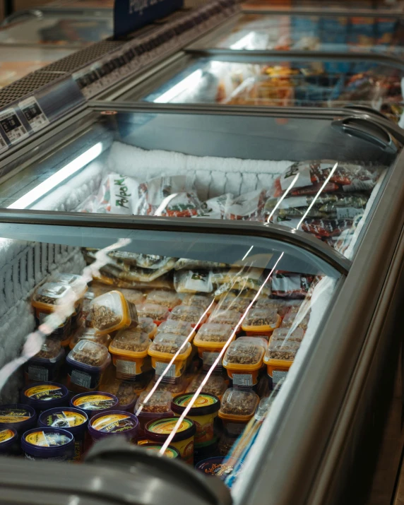 a display case filled with lots of different kinds of food, pexels, hyperrealism, ice seracs, thumbnail, gif, sausages