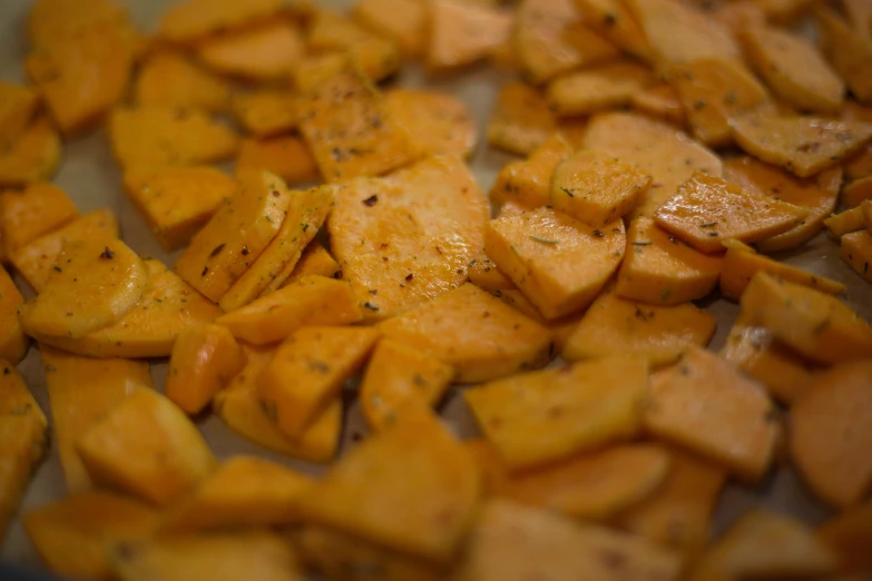 a pan that has some kind of food on it, a macro photograph, by Amelia Peláez, fan favorite, chips, pumpkin, unedited