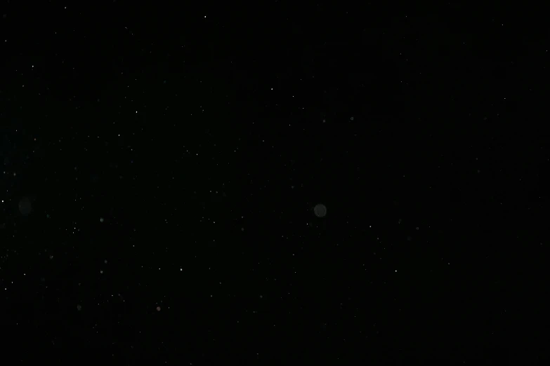 the moon is shining brightly in the dark sky, a picture, by Mathias Kollros, low quality grainy, deathstar, hanging out with orbs, very grainy image