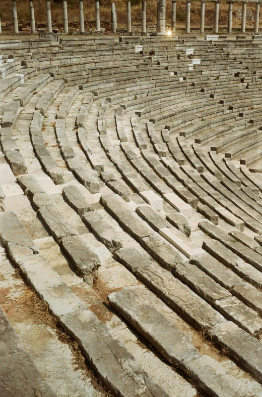 a man standing in the middle of a stone amplisk, renaissance, staggered terraces, arena, sitting down, crisp lines