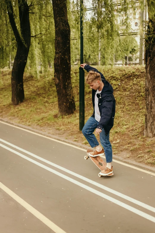 a man riding a skateboard down the middle of a road, dasha taran, youth, corduroy, high quality upload