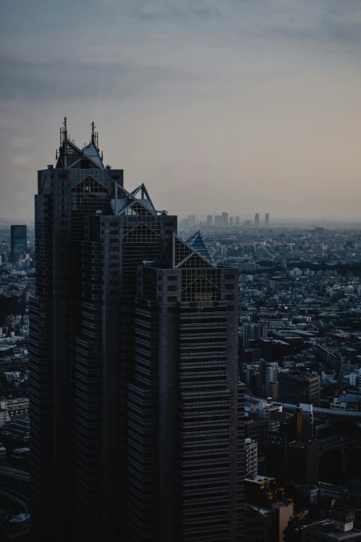 a view of a city from the top of a building, pexels contest winner, dusty abandoned shinjuku, tall metal towers, low quality photo, dusk setting