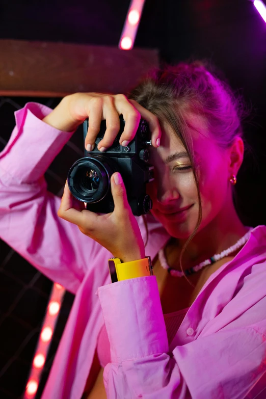 a woman taking a picture with a camera, by Julia Pishtar, neon vibes, ukraine. professional photo, club photography, high quality upload