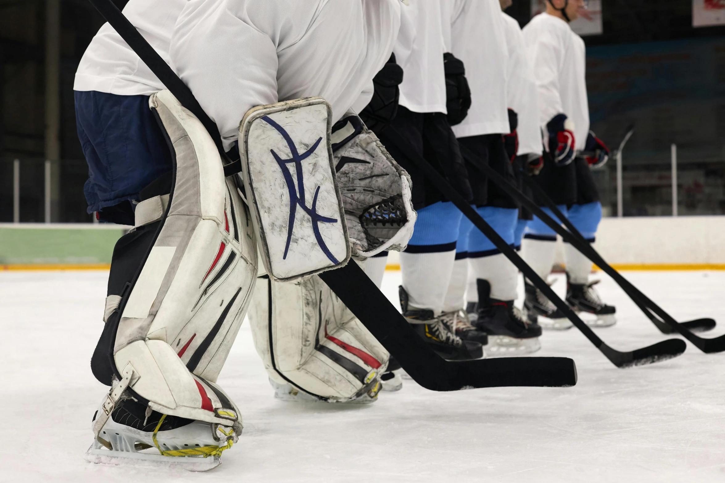 a group of young men playing a game of hockey, by Tom Bonson, pexels, figuration libre, full ice hockey goalie gear, closeup of arms, 15081959 21121991 01012000 4k, panoramic shot