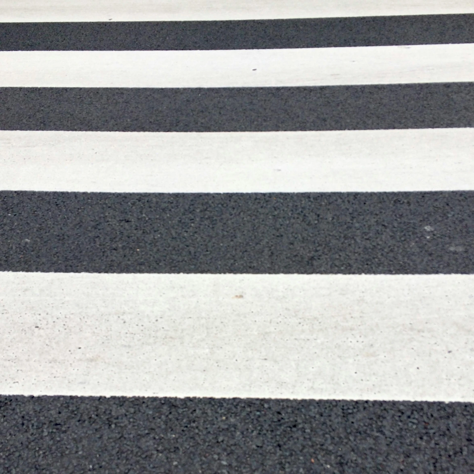 a red fire hydrant sitting on the side of a road, by Carey Morris, op art, black! and white colors, detail texture, crosswalk, thin straight lines