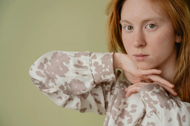 a woman with red hair posing for a picture, inspired by Aimé Barraud, trending on pexels, visual art, wear's beige shirt, delicate patterned, soft colours, portrait mode photo