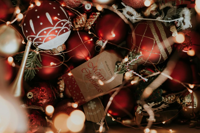 a close up of a bunch of christmas ornaments, pexels contest winner, warm coloured, rectangle, instagram post, maroon