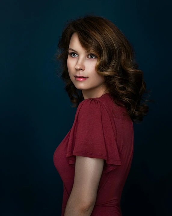 a woman in a red dress posing for a picture, inspired by Yousuf Karsh, unsplash, clara oswald, square, rachel mcadams, high quality photo