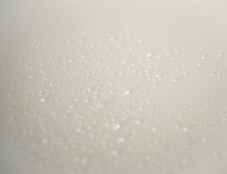 a close up of water droplets on a white surface, an ultrafine detailed painting, ethereal lighting - h 640, zinc white, detailed product shot, white plastic