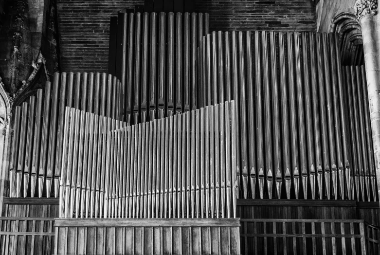 a black and white photo of a pipe organ, a black and white photo, inspired by Bryan Organ, precisionism, broken composition, a wooden, wall, good