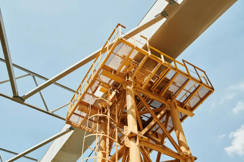 a crane sitting on top of a metal structure, view from the ground, award - winning crisp details, best practice, brown