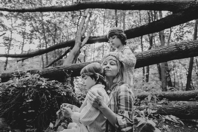 a black and white photo of a family in the woods, pexels, conceptual art, portrait of max caulfield, mother nature, cottagecore hippie, 3 woodland critters