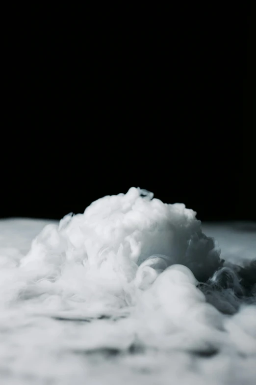 a pile of snow sitting on top of a snow covered ground, inspired by Kim Keever, unsplash, conceptual art, fat cloud, on black background, whipped cream, background ( smoke