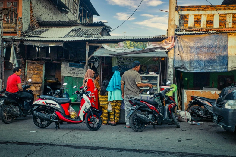 a group of people standing next to motorcycles, by Meredith Dillman, pexels contest winner, sumatraism, stood outside a corner shop, batik, breakfast, square