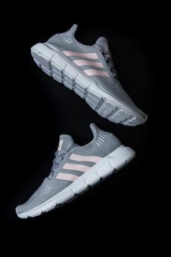 a pair of grey and pink sneakers on a black background, adidas, oceanside, nimbus, rectangle