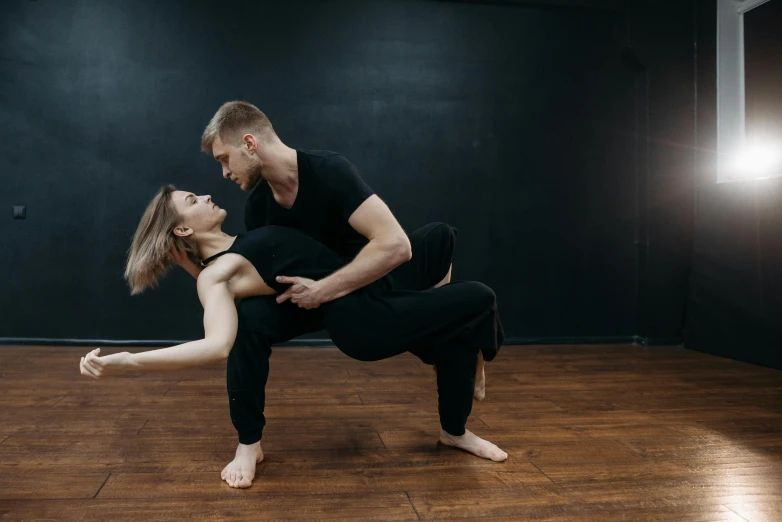 a man and a woman in a dance pose, pexels contest winner, thumbnail, looking partly to the left, brooke ashling, various posed