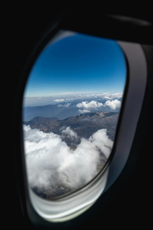 a view of the sky through an airplane window, pexels contest winner, nepal, thumbnail, multiple stories, 1 2 9 7