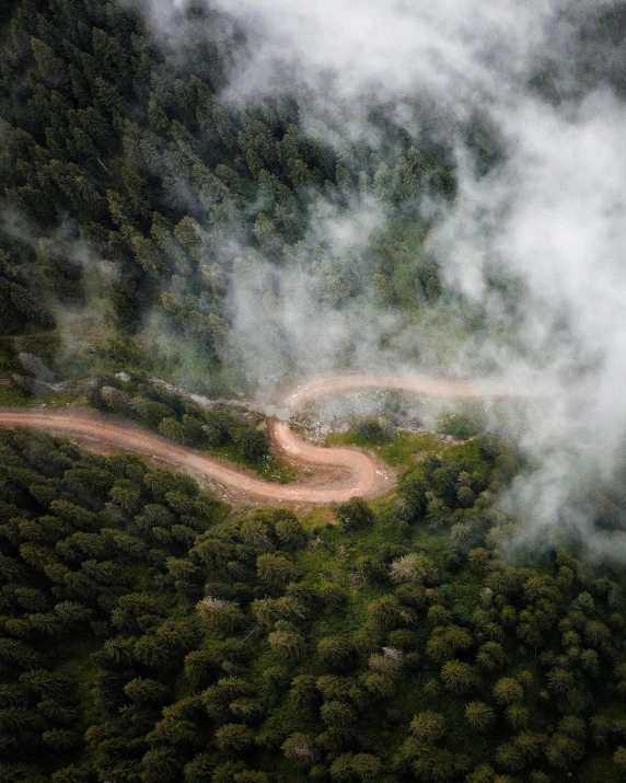 a winding road in the middle of a forest, pexels contest winner, flying through the clouds, off-roading, 2 5 6 x 2 5 6 pixels, high angle