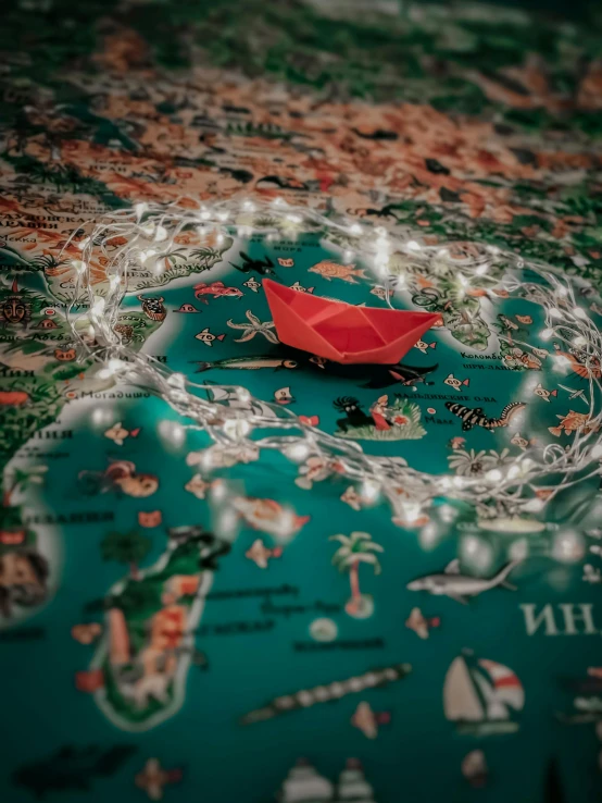 a red paper boat floating on top of a map, a jigsaw puzzle, by Adam Marczyński, digital art, lights on, medium close shot, multiple stories, overview