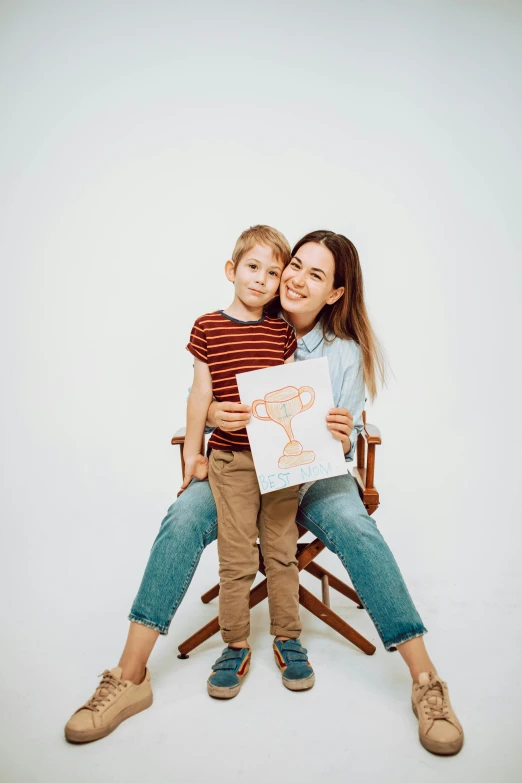 a woman and a child are sitting on a chair, a child's drawing, pexels contest winner, set against a white background, promotional image, portrait of tall, advertisement photo