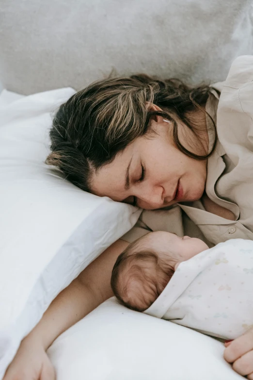 a woman laying in bed with a baby, pexels contest winner, renaissance, profile image, two exhausted, multiple layers, maternity feeling