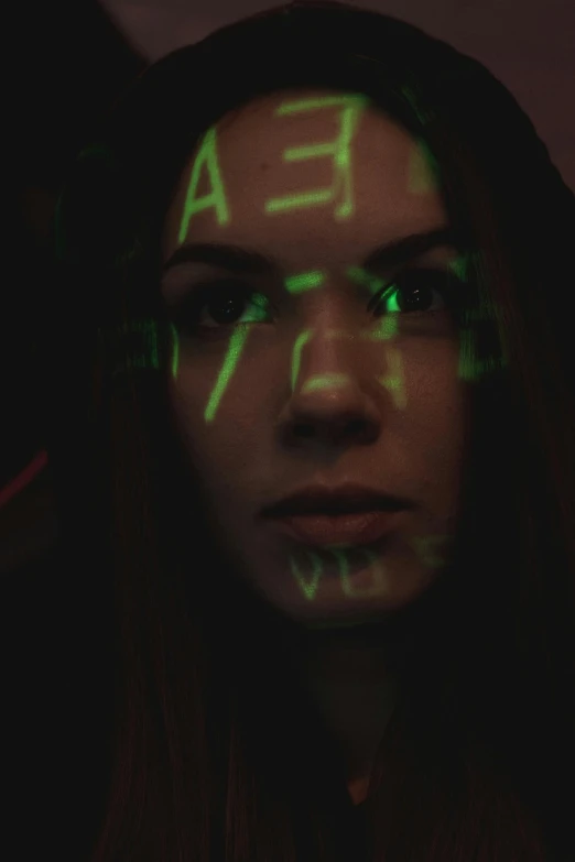 a woman with green neon writing on her face, trending on pexels, holography, portrait of computer & circuits, mysterious girl, low quality photo, covered in runes