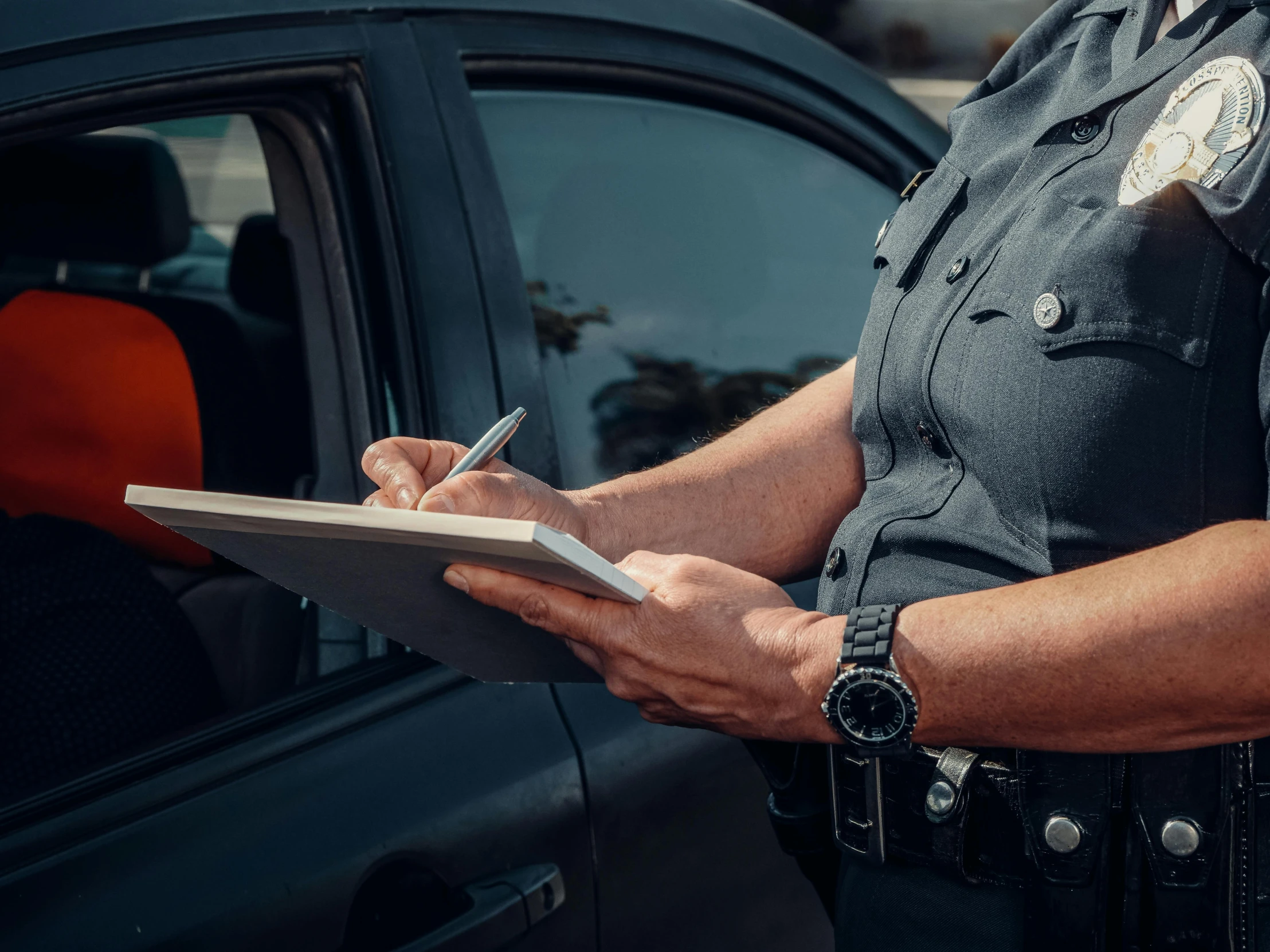 a police officer writing on a clipboard in front of a car, shutterstock, high quality product image”, 15081959 21121991 01012000 4k, digitally enhanced, contain