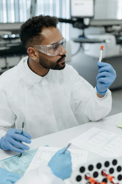 a man in a lab coat and goggles holding a test tube, trending on reddit, diverse, wearing gloves, thumbnail, concentrated