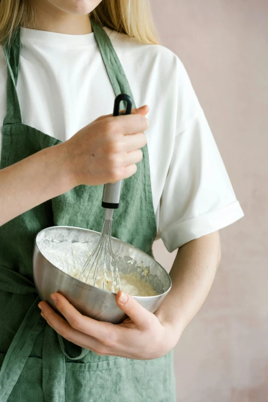 a young girl holding a mixing bowl and whisk whisk whisk whisk whisk whisk whis, inspired by Yukimasa Ida, trending on unsplash, whipped cream on top, greens), grey, large tall