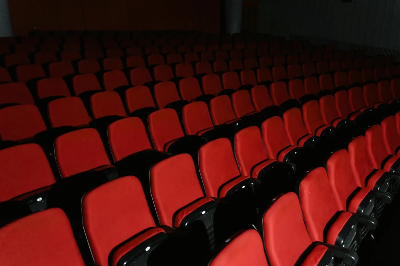 an empty auditorium with rows of red seats, pexels, incoherents, instagram post, on black background, calarts, item