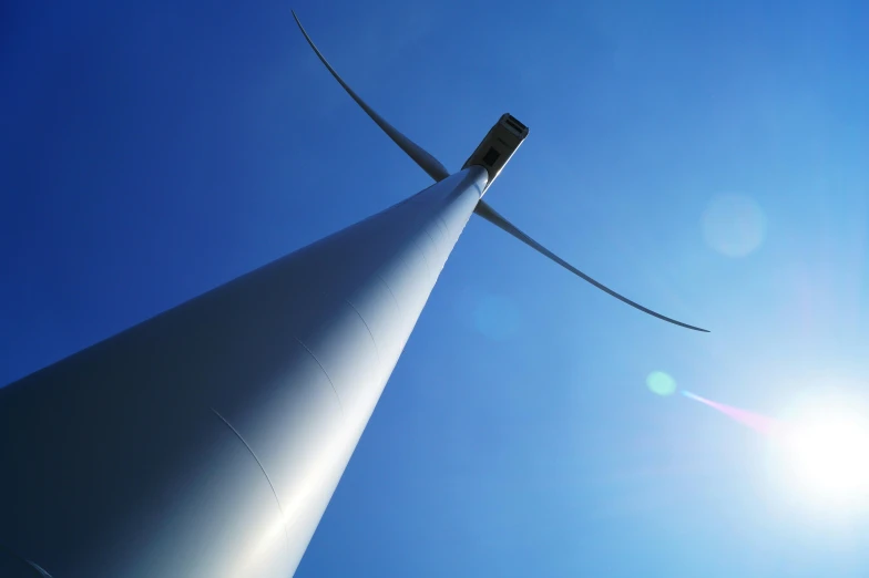 a close up of a wind turbine on a sunny day, by Carey Morris, pexels contest winner, conceptual art, high polygon, towering, lit from below, 15081959 21121991 01012000 4k