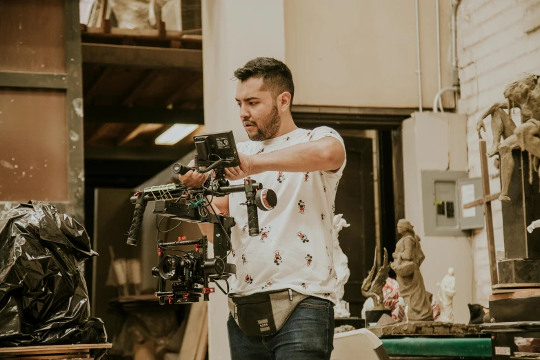 a man that is standing in front of a camera, a picture, cinematográfica, in an action pose, close to the camera, promotional image
