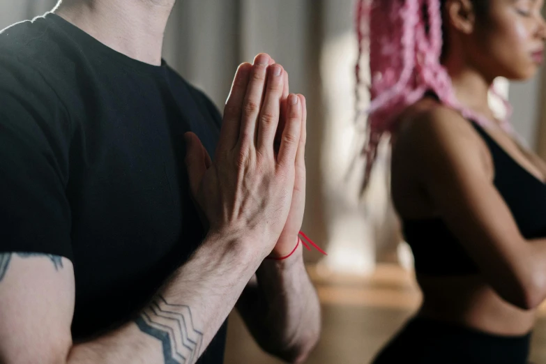 a man and a woman doing yoga together, trending on pexels, renaissance, prayer hands, looking from shoulder, low quality photo, good vibrations