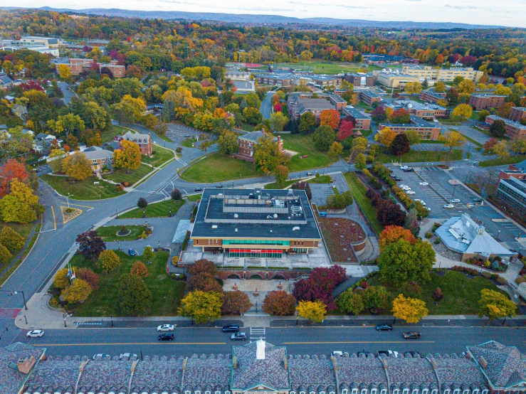 an aerial view of a city in the fall, heidelberg school, craigville, front facing shot, aerial shot from the drone, exterior shot