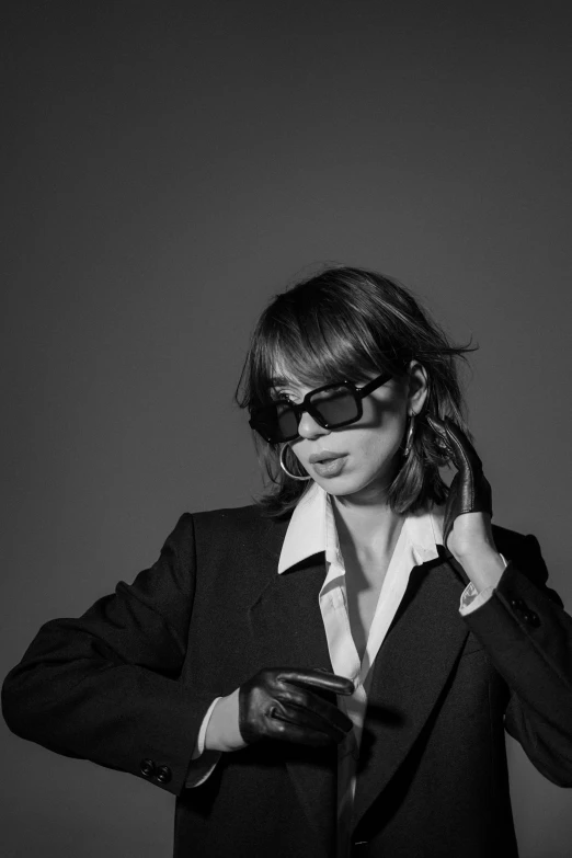 a black and white photo of a woman in a suit, inspired by Leila Faithfull, with sunglass, shigeto koyama, okita sougo, r&b