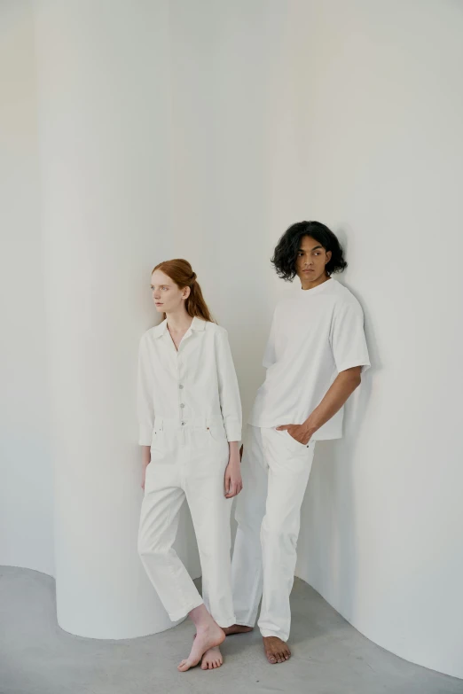 a couple of women standing next to each other, inspired by Jonas De Ro, trending on unsplash, wearing white clothes, like a catalog photograph, off - white collection, androgynous male