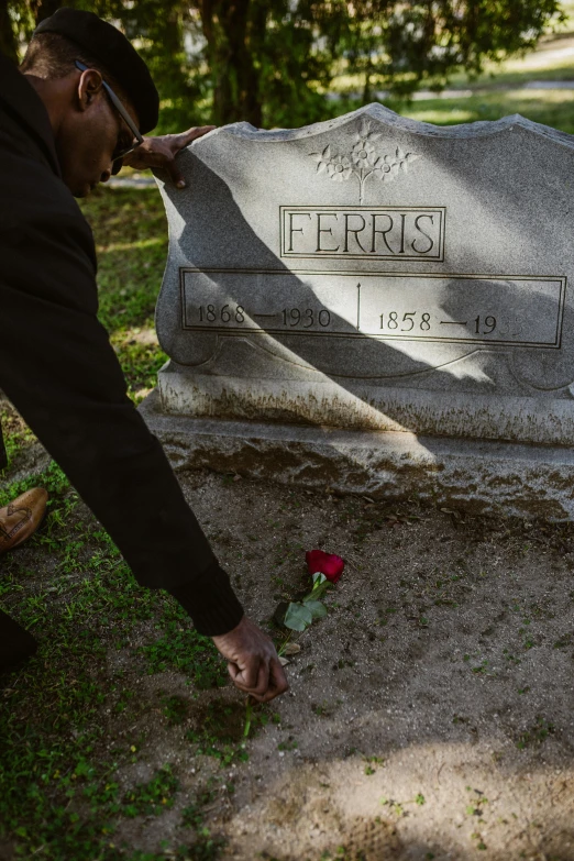 a man placing a rose on a grave, an album cover, by Amos Ferguson, vanitas, in louisiana, profile image, george floyd, charles o. perry