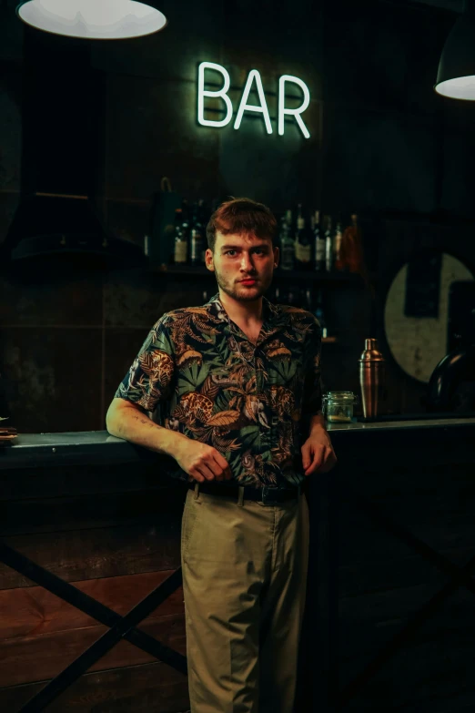 a man standing in front of a bar, dasha taran, solid background, low iso, he is about 20 years old | short
