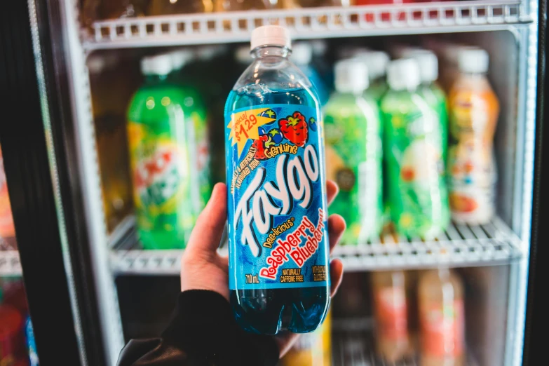 a person holding a bottle of soda in front of a refrigerator, a picture, tumblr, rasquache, dayglo blue, fanoos, high quality product image”, lasso