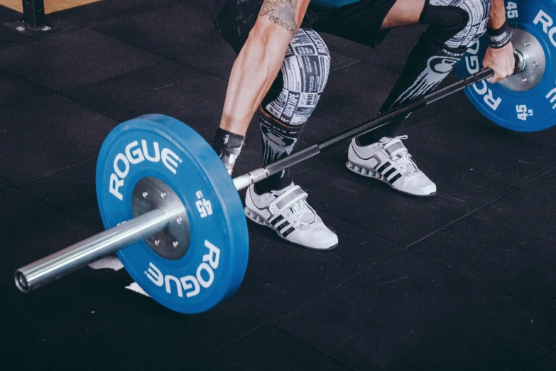 a man squatting with a barbell in a gym, by Adam Marczyński, pexels contest winner, focus on sneakers only, panoramic shot, avatar image, extreme details