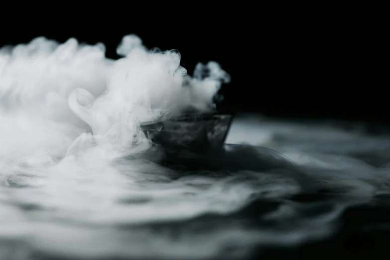 a smoke boat floating on top of a body of water, a black and white photo, unsplash, process art, whipped cream, close up of single sugar crystal, high quality product image”, cryogenic pods