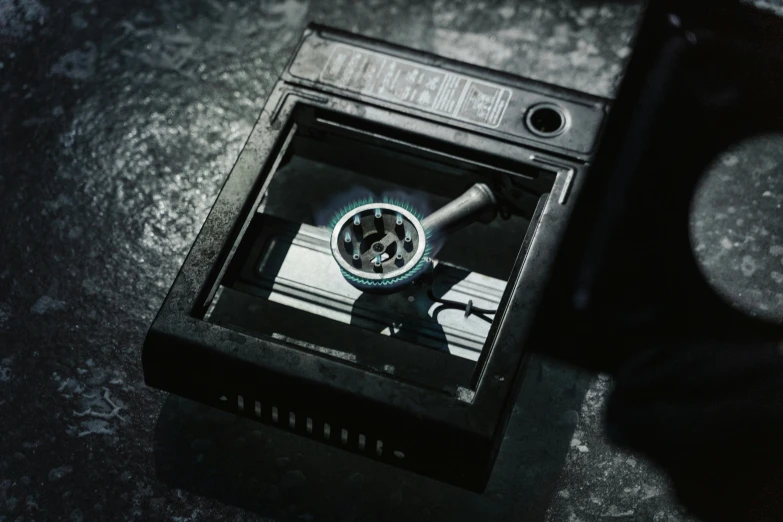 a close up of a person holding a camera, inspired by Elsa Bleda, holography, with an ashtray on top, hasselblad photography, blade runner artifacts, instagram post