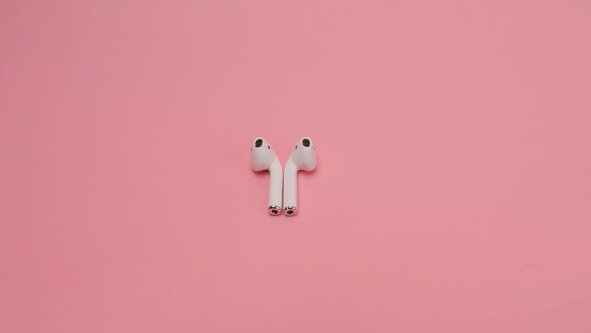 a pair of airpods sitting on top of a pink surface, by Gavin Hamilton, trending on pexels, drone footage, beans in his eyes sockets, pink zen style, black white pink