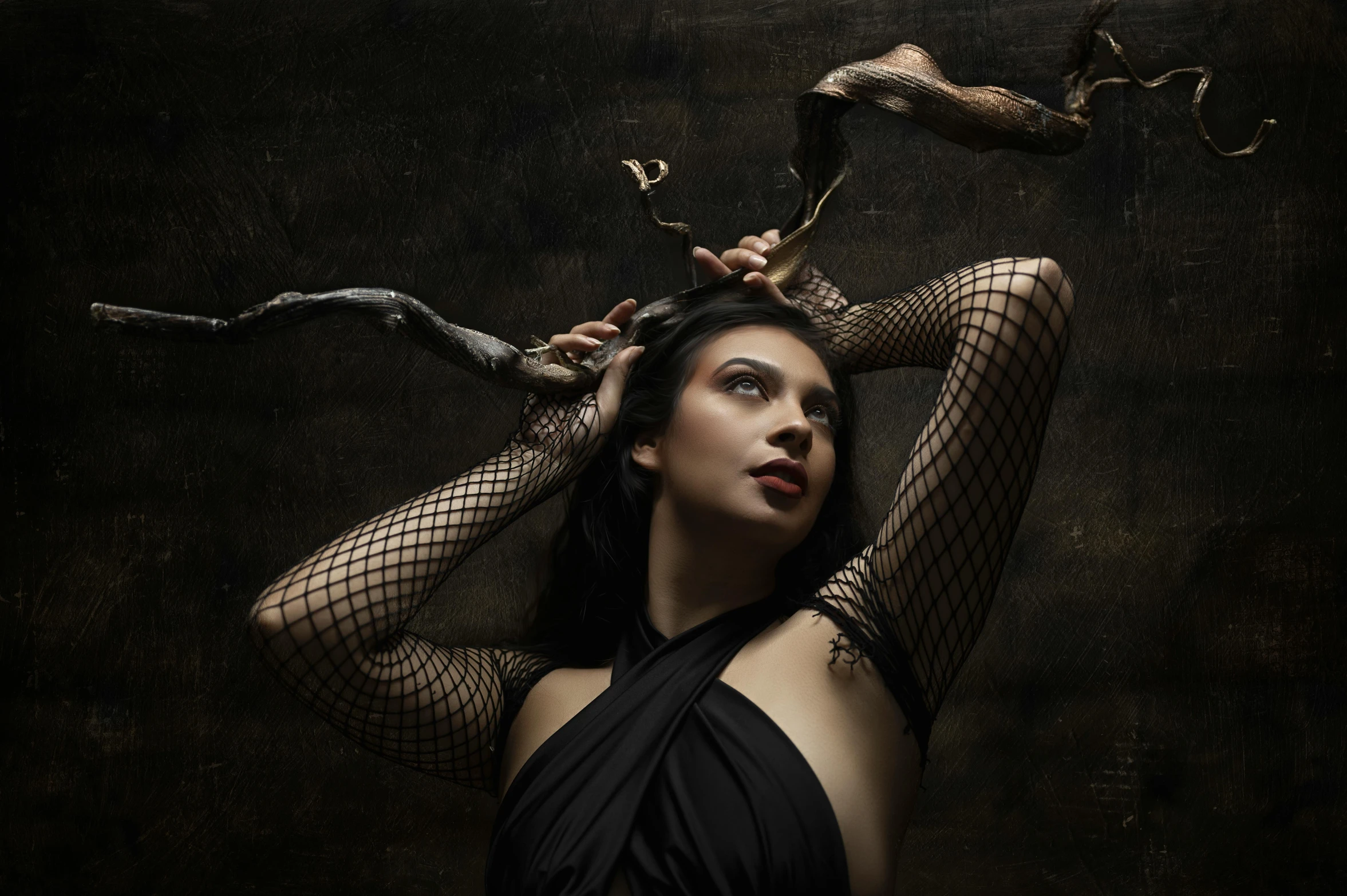 a woman in a black dress with a snake on her head, an album cover, inspired by Brooke Shaden, pexels contest winner, renaissance, bat claws, looking partly to the left, witch clothes, portrait sophie mudd