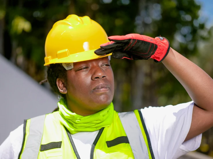 a man wearing a hard hat and safety vest, inspired by Afewerk Tekle, pexels contest winner, renaissance, visor covering eyes, on a sunny day, avatar image, skeptical expression