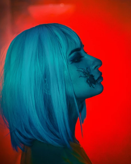 a woman with blue hair standing in front of a red light, an album cover, inspired by Elsa Bleda, trending on pexels, antipodeans, feral languid emma roberts, profile image, red and cyan ink, toxicity